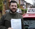 Davy with Driving test pass certificate